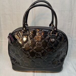 Lounge fly loves Hello Kitty, black patent leather dome handbag from 2012